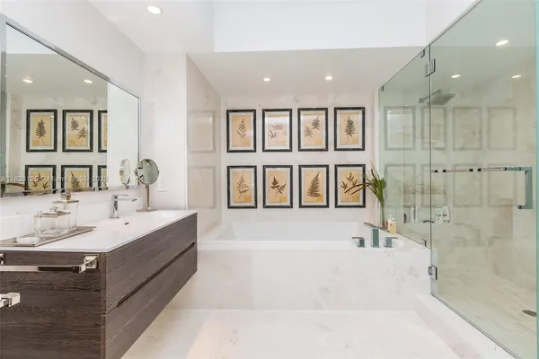 a bedroom with bed and a chandelier