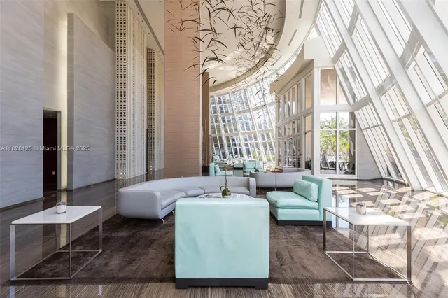 a bedroom with a bed and painting on the wall