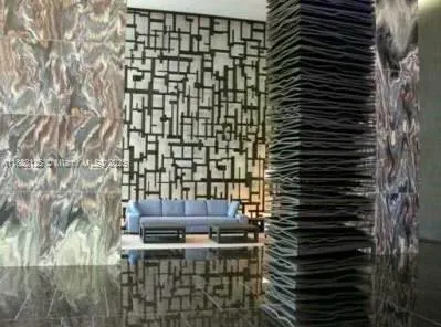 a view of a patio with a table and chairs