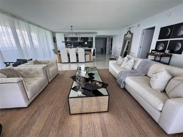 a bedroom with two bed and a window