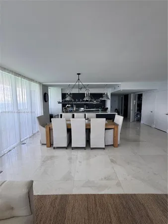 a large room with a couch and a bookshelf