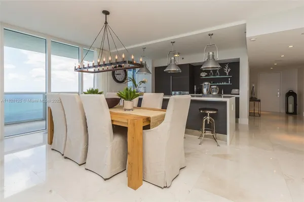 a bedroom with a large bed and a flat screen tv