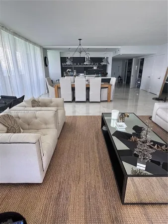 a living room with furniture and window