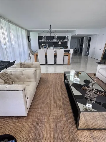 a living room with furniture and window