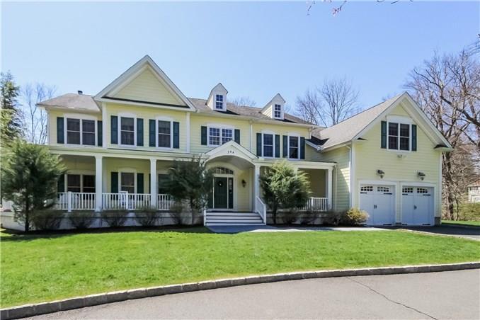 344 Cognewaugh Road Greenwich, CT 06807 - Photo 1 of 1 a front view of a house with a yard