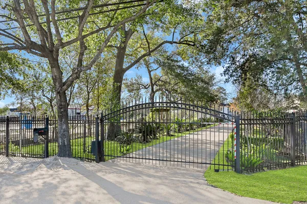 a view of a wrought iron fences in front of house