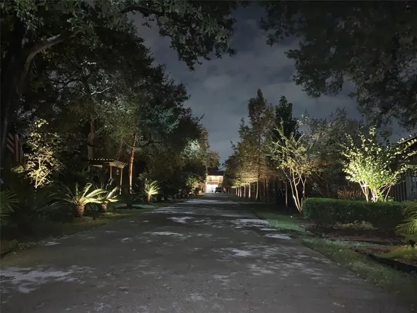 a view of street and slide with green space