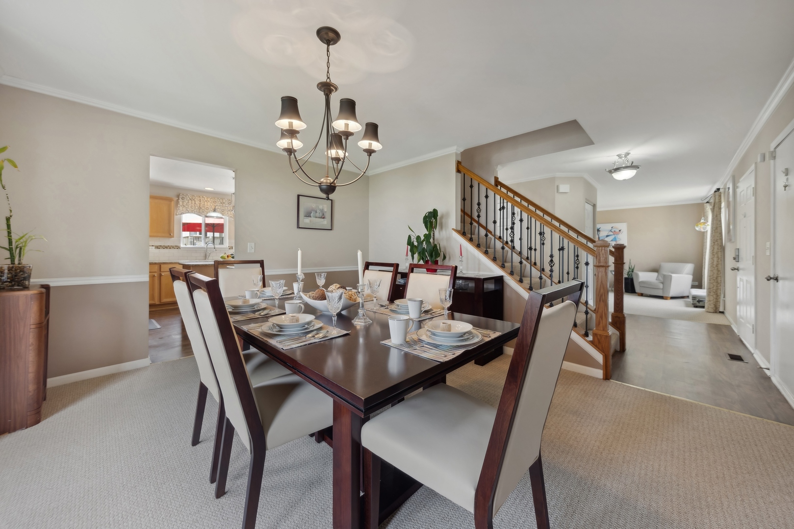 373 Foster Way Bolingbrook, IL 60440 - Photo 14 of 35 a view of a dining room and livingroom with furniture wooden floor a chandelier