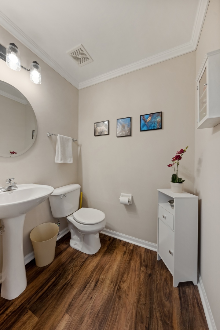 373 Foster Way Bolingbrook, IL 60440 - Photo 15 of 35 a bathroom with a toilet sink and mirror