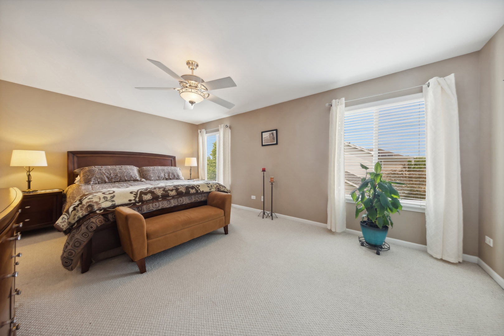 373 Foster Way Bolingbrook, IL 60440 - Photo 16 of 35 a spacious bedroom with a bed and a chandelier