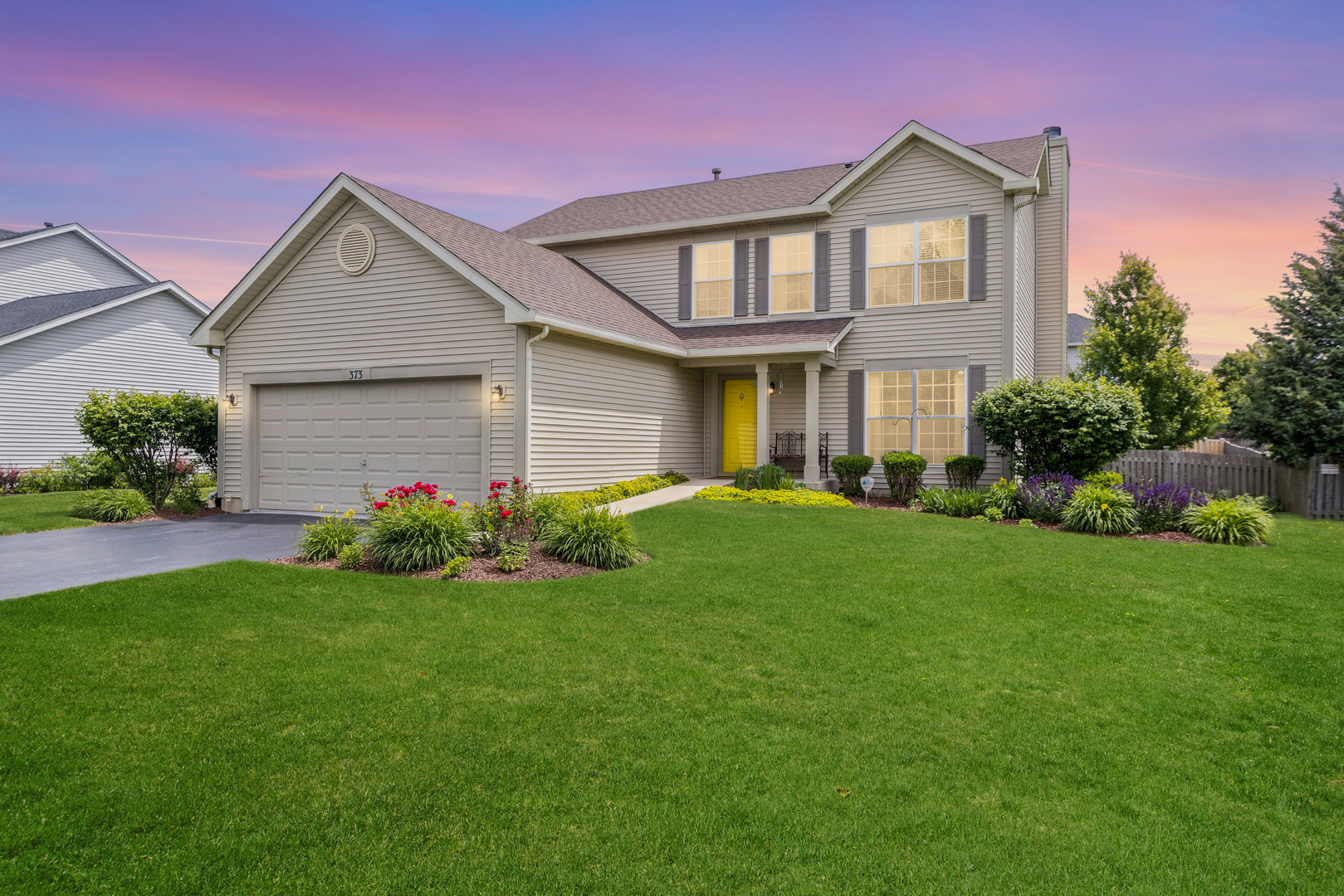 373 Foster Way Bolingbrook, IL 60440 - Photo 2 of 35 a front view of a house with a yard and garage