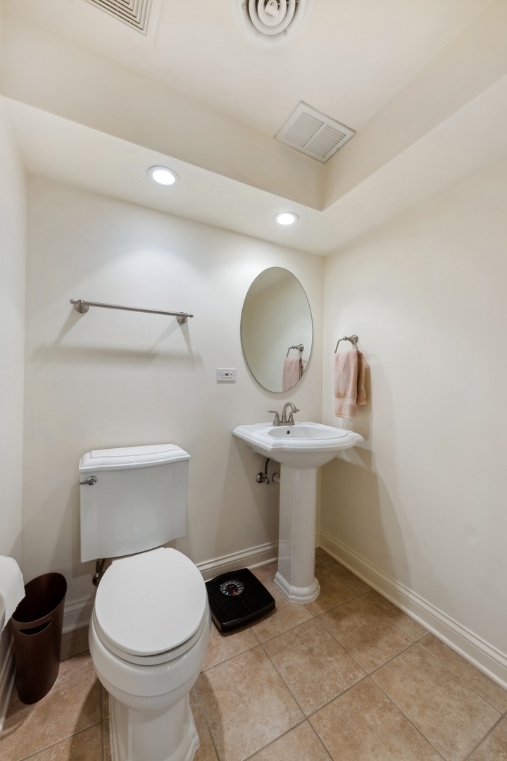 373 Foster Way Bolingbrook, IL 60440 - Photo 27 of 35 a bathroom with a sink a mirror and toilet