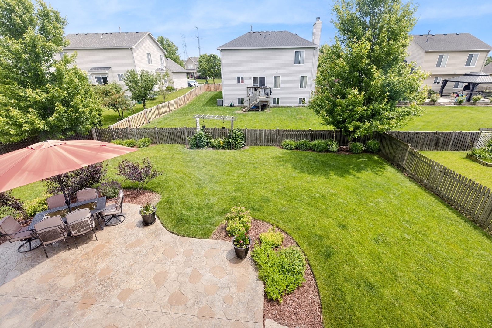 373 Foster Way Bolingbrook, IL 60440 - Photo 3 of 35 a view of a garden with a swimming pool