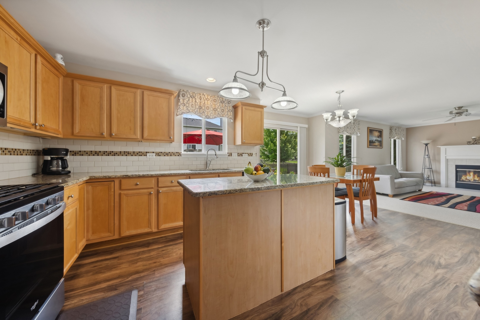 373 Foster Way Bolingbrook, IL 60440 - Photo 7 of 35 a kitchen with stainless steel appliances granite countertop a refrigerator a sink dishwasher a stove and white cabinets with wooden floor