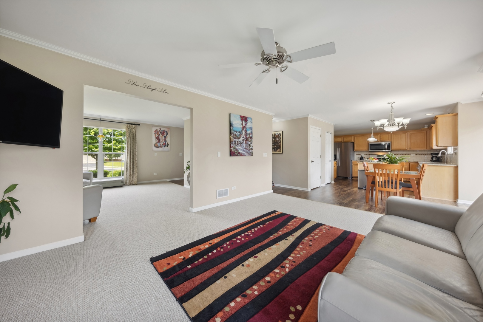373 Foster Way Bolingbrook, IL 60440 - Photo 10 of 35 a living room with furniture and a flat screen tv