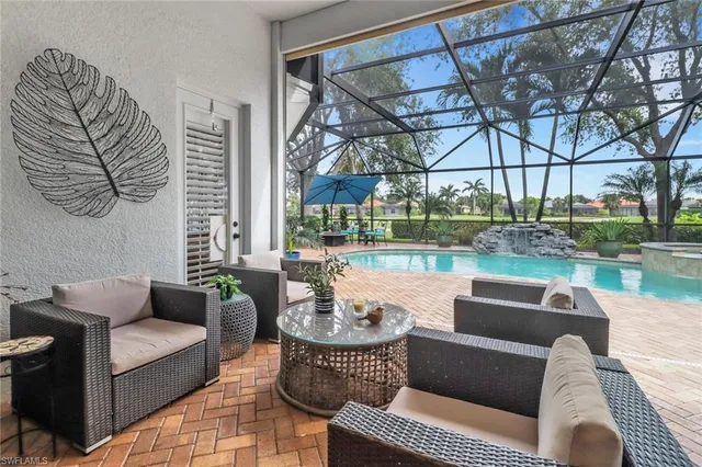 a view of a patio with couches chairs and a fire pit