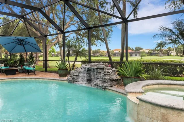 a view of a swimming pool with a patio
