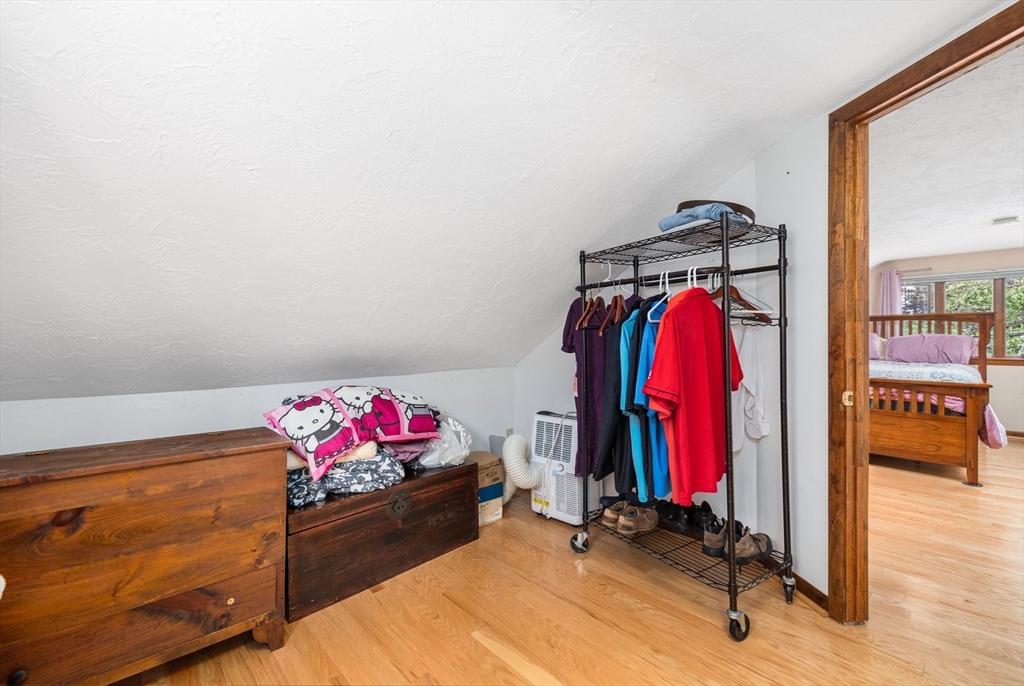 31 Tyson Road Worcester, MA 01606 - Photo 15 of 27 a bed room with a bed and a couch