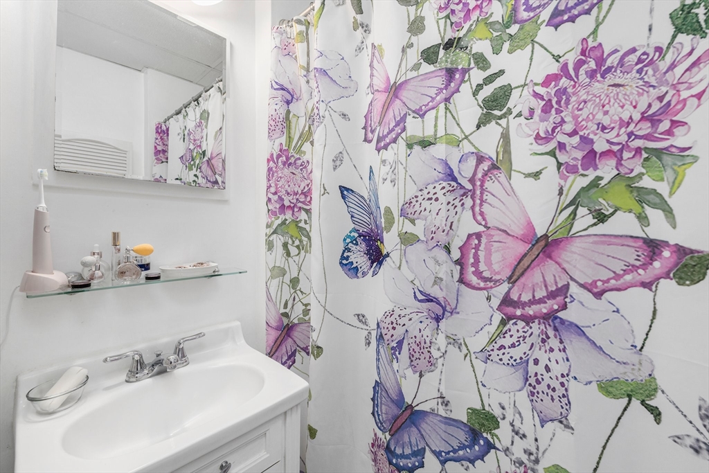 31 Tyson Road Worcester, MA 01606 - Photo 19 of 27 a bathroom with a sink and mirror with painted walls