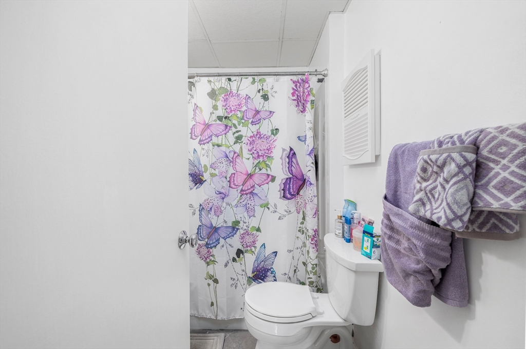 31 Tyson Road Worcester, MA 01606 - Photo 20 of 27 a white toilet sitting next to a bathroom sink