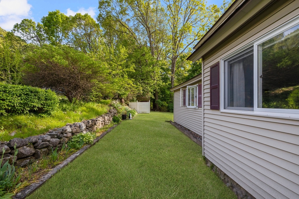 31 Tyson Road Worcester, MA 01606 - Photo 23 of 27 a view of a house with a backyard