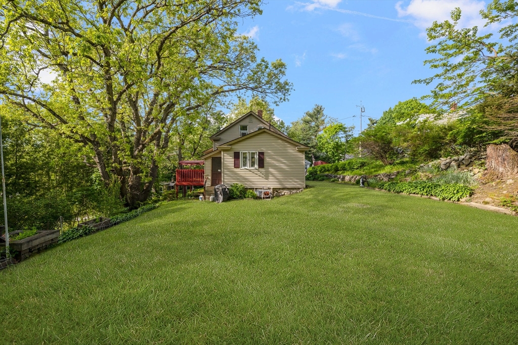 31 Tyson Road Worcester, MA 01606 - Photo 26 of 27 a house with green field in front of it
