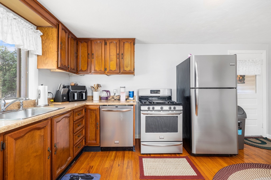 31 Tyson Road Worcester, MA 01606 - Photo 5 of 27 a kitchen with stainless steel appliances granite countertop a refrigerator and a sink