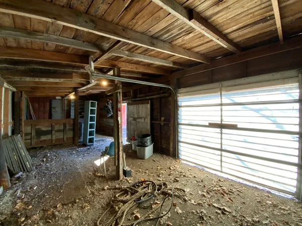a view of empty room with wooden walls
