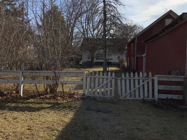 a view of a field with an trees