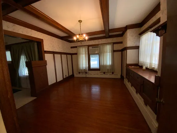 a view of gallery with wooden floor