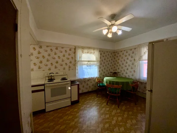 a kitchen with a stove and a microwave