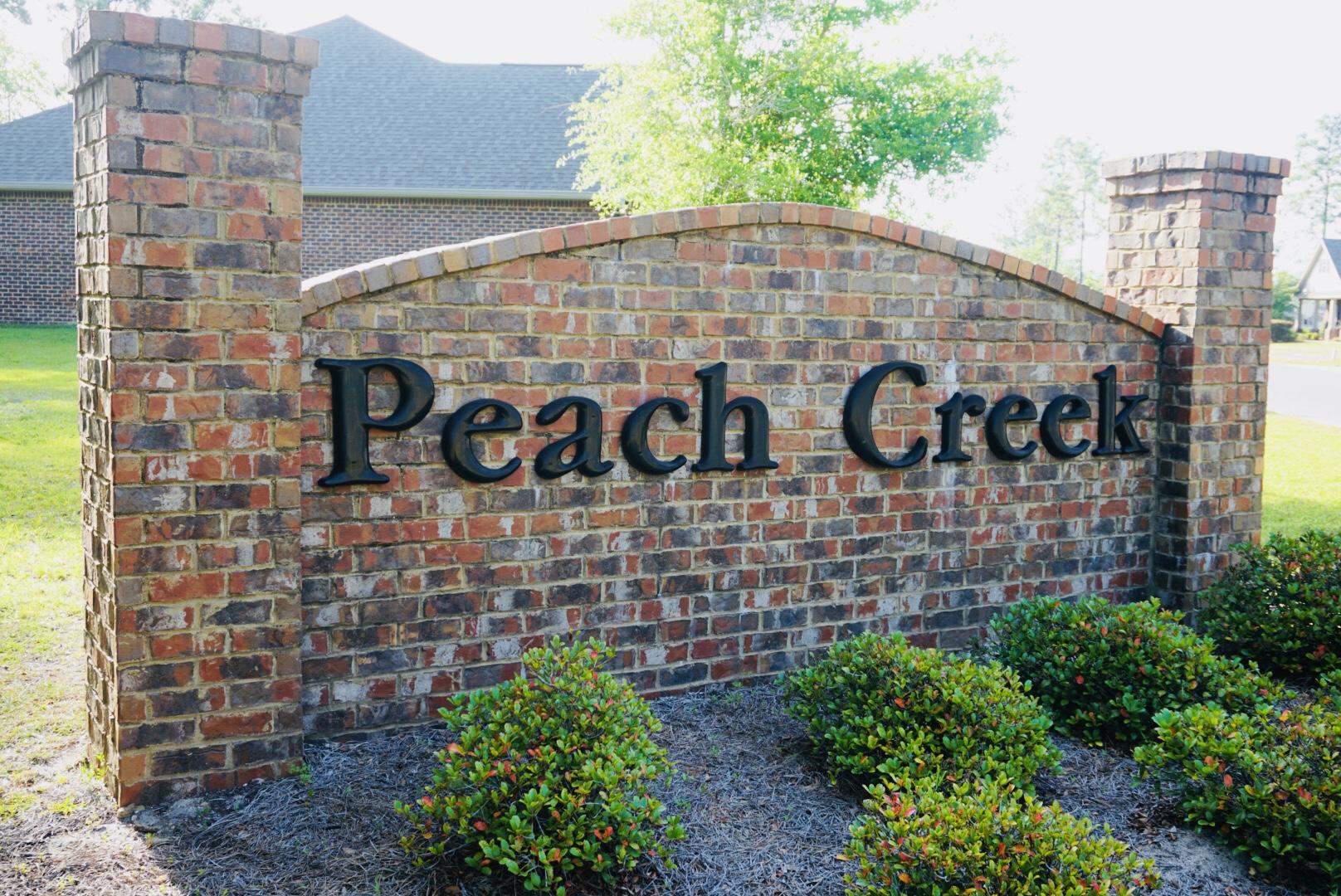 131 Wayne Trail Santa Rosa Beach, FL 32459 - Photo 14 of 15 a street sign on a brick wall