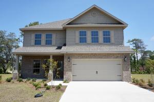 131 Wayne Trail Santa Rosa Beach, FL 32459 - Photo 4 of 15 a front view of a house with garden