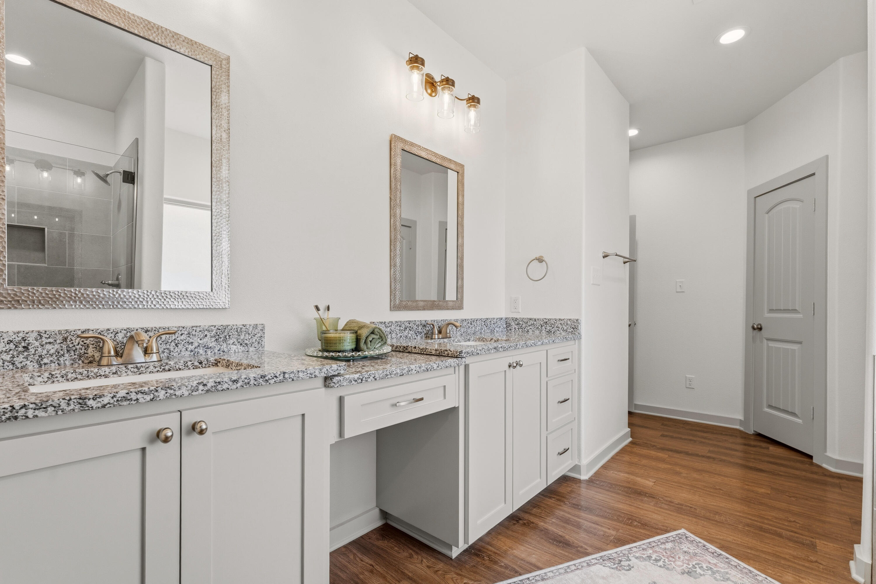 19215 County Road 2240 Lubbock, TX 79423 - Photo 19 of 36 a bathroom with a granite countertop sink double and mirror