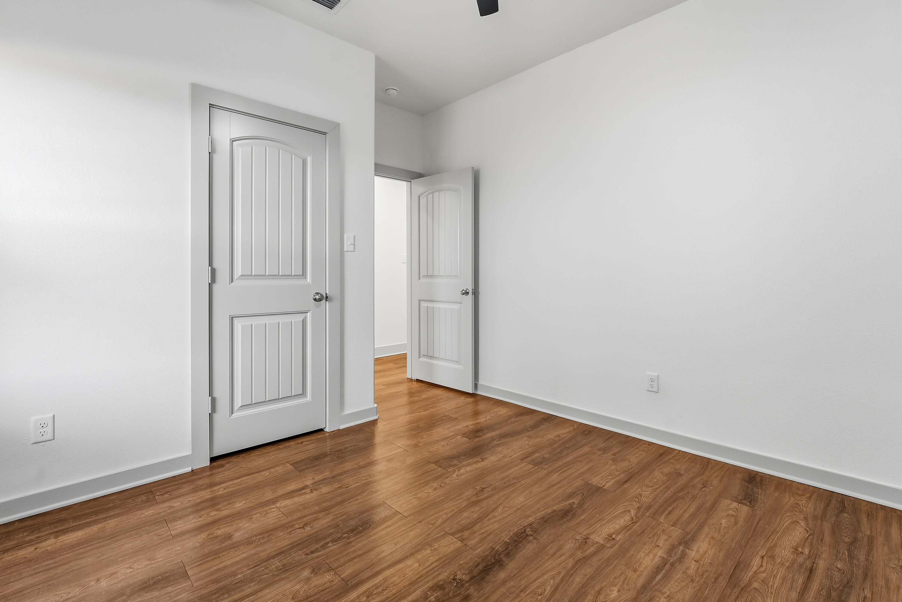 19215 County Road 2240 Lubbock, TX 79423 - Photo 22 of 36 a view of an empty room with wooden floor