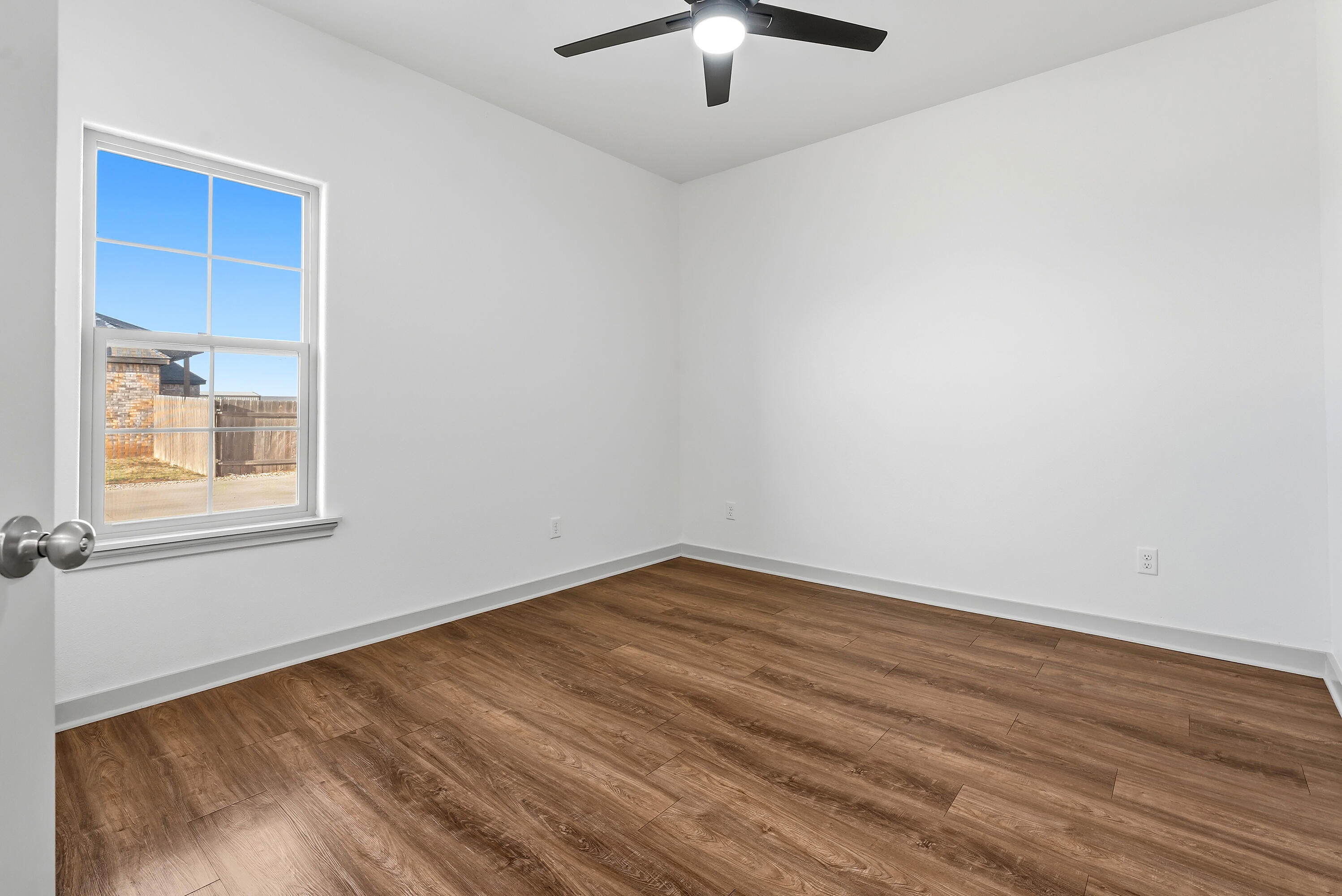 19215 County Road 2240 Lubbock, TX 79423 - Photo 23 of 36 an empty room with a window