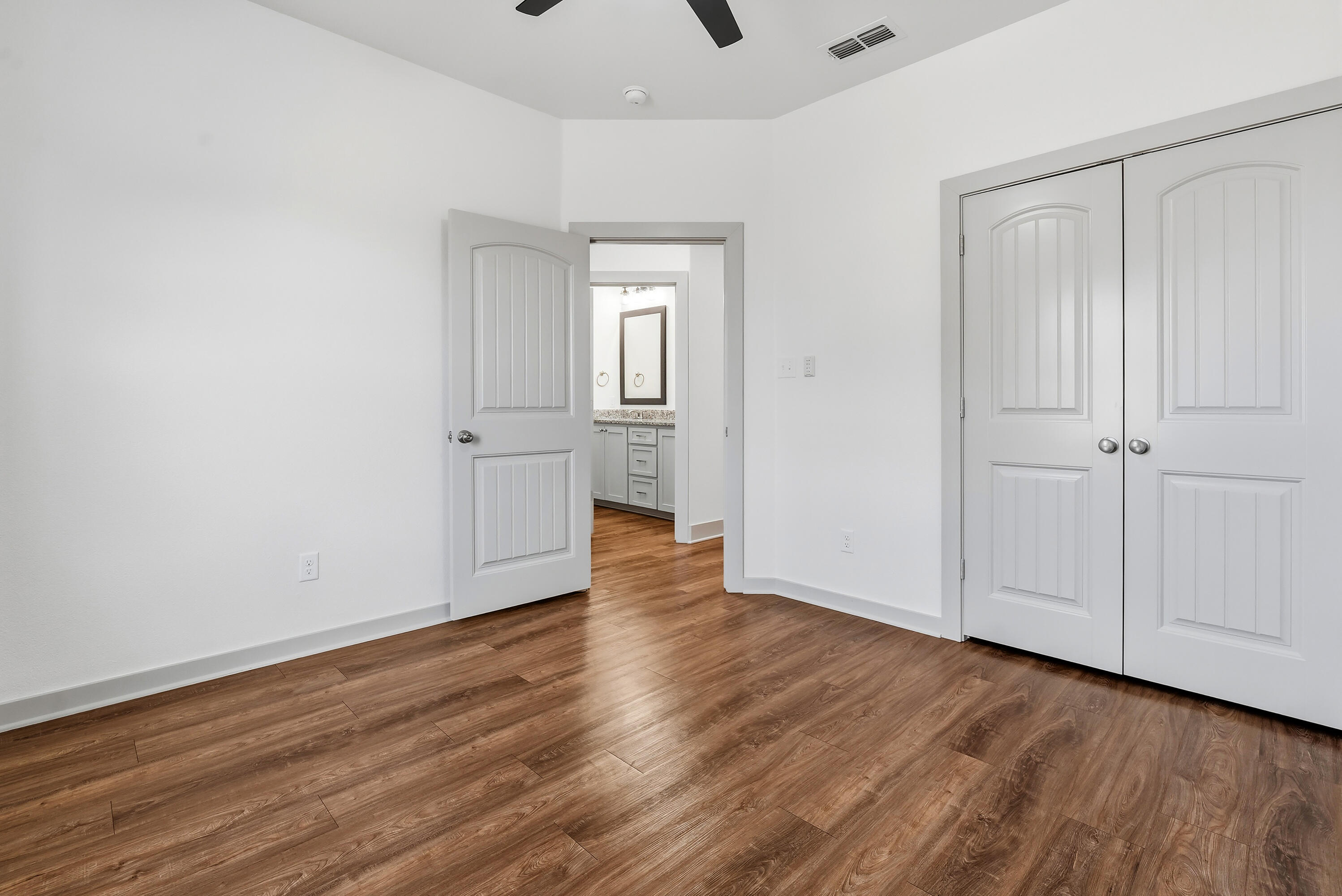 19215 County Road 2240 Lubbock, TX 79423 - Photo 27 of 36 a view of an empty room with wooden floor