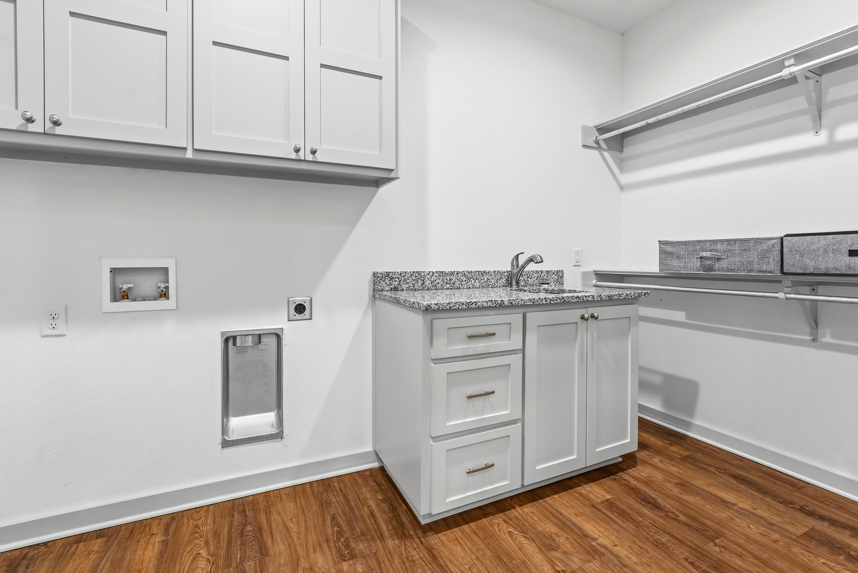 19215 County Road 2240 Lubbock, TX 79423 - Photo 29 of 36 a kitchen with granite countertop a sink cabinets and stainless steel appliances