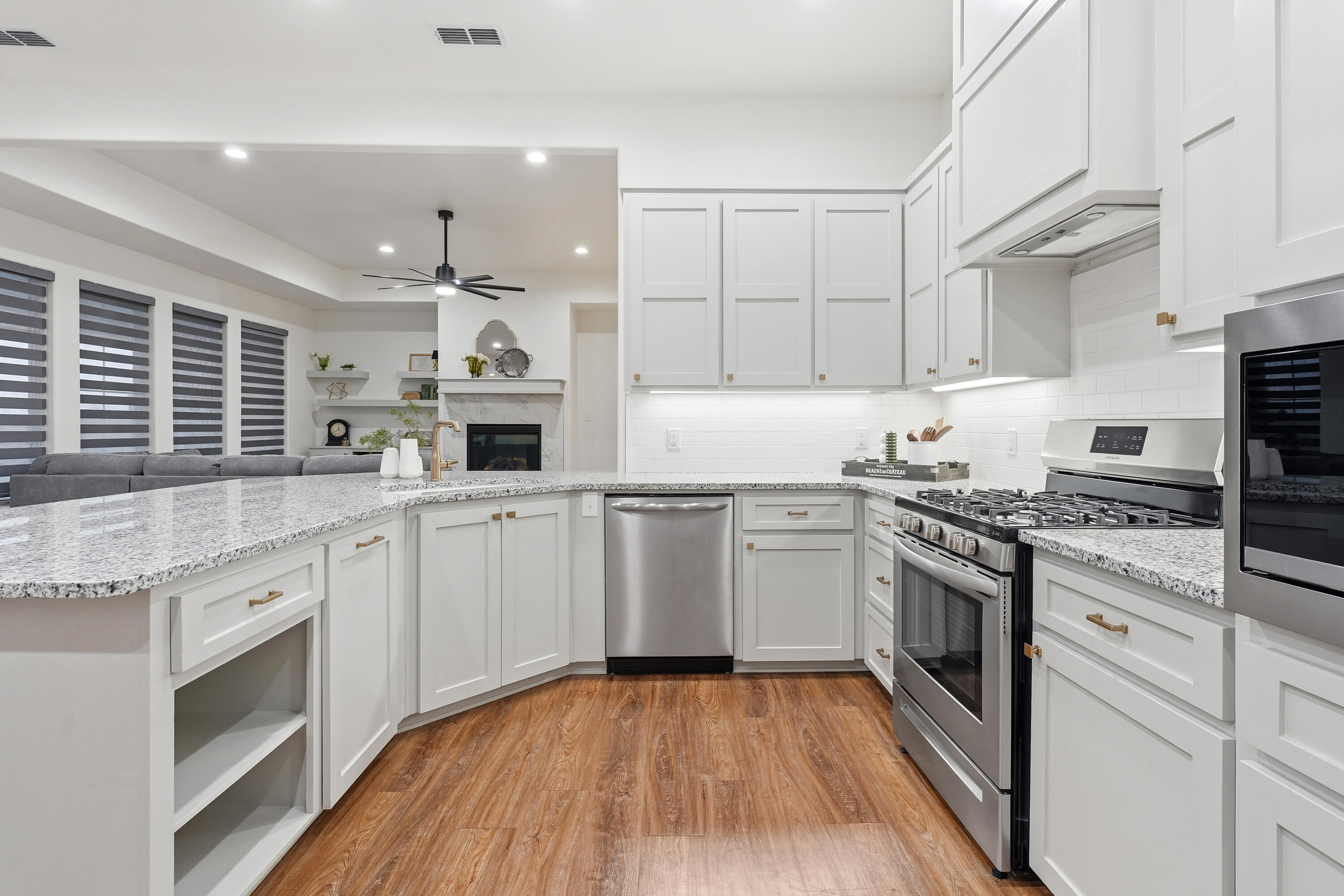 19215 County Road 2240 Lubbock, TX 79423 - Photo 7 of 36 a kitchen with granite countertop a stove top oven and sink