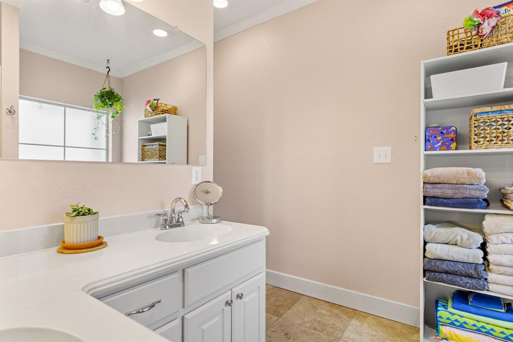 10609 Aquilla Trail Waco, TX 76708 - Photo 24 of 30 Dual vanity with white cabinetry and integrated sinks
