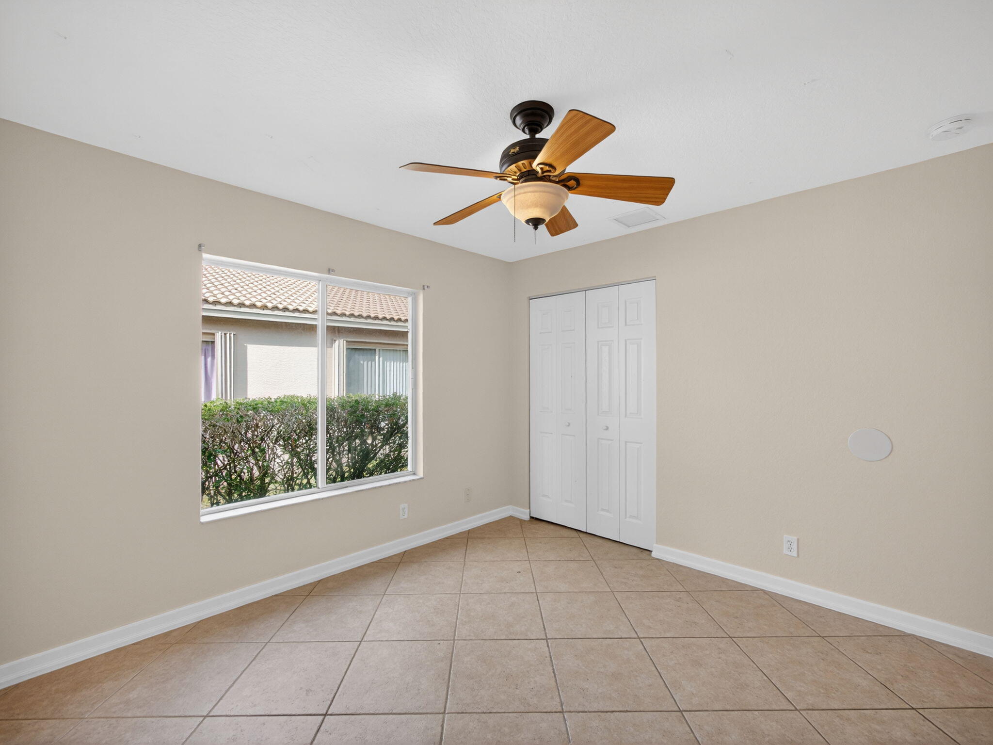 4358 Southeast Graham Drive Stuart, FL 34997 - Photo 20 of 34 a view of an empty room with a window