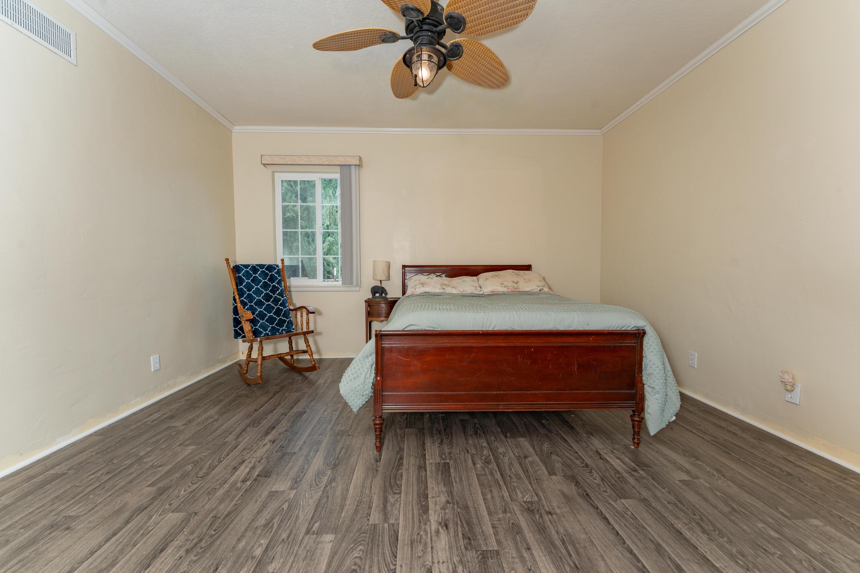 570 North Birch Avenue Reedley, CA 93654 - Photo 29 of 52 a bedroom with a bed and a window