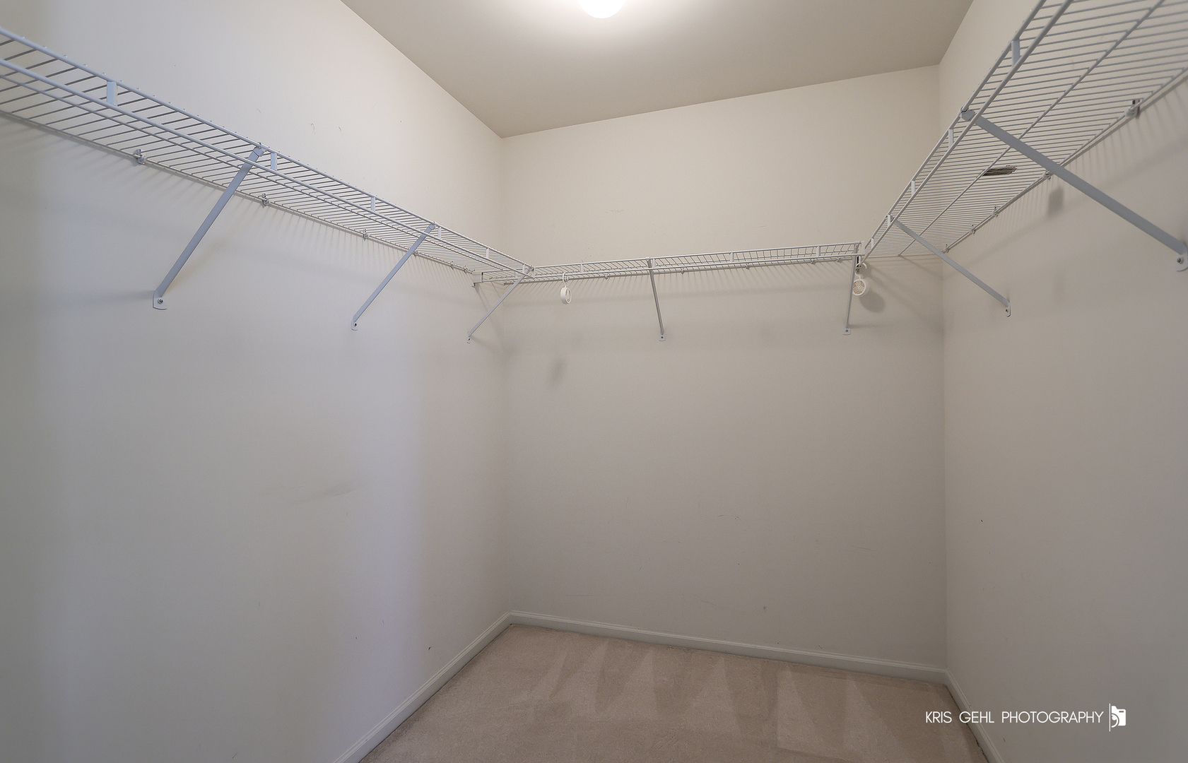 25619 West Bluestem Road Round Lake, IL 60073 - Photo 18 of 33 a view of a room with racks on the wall