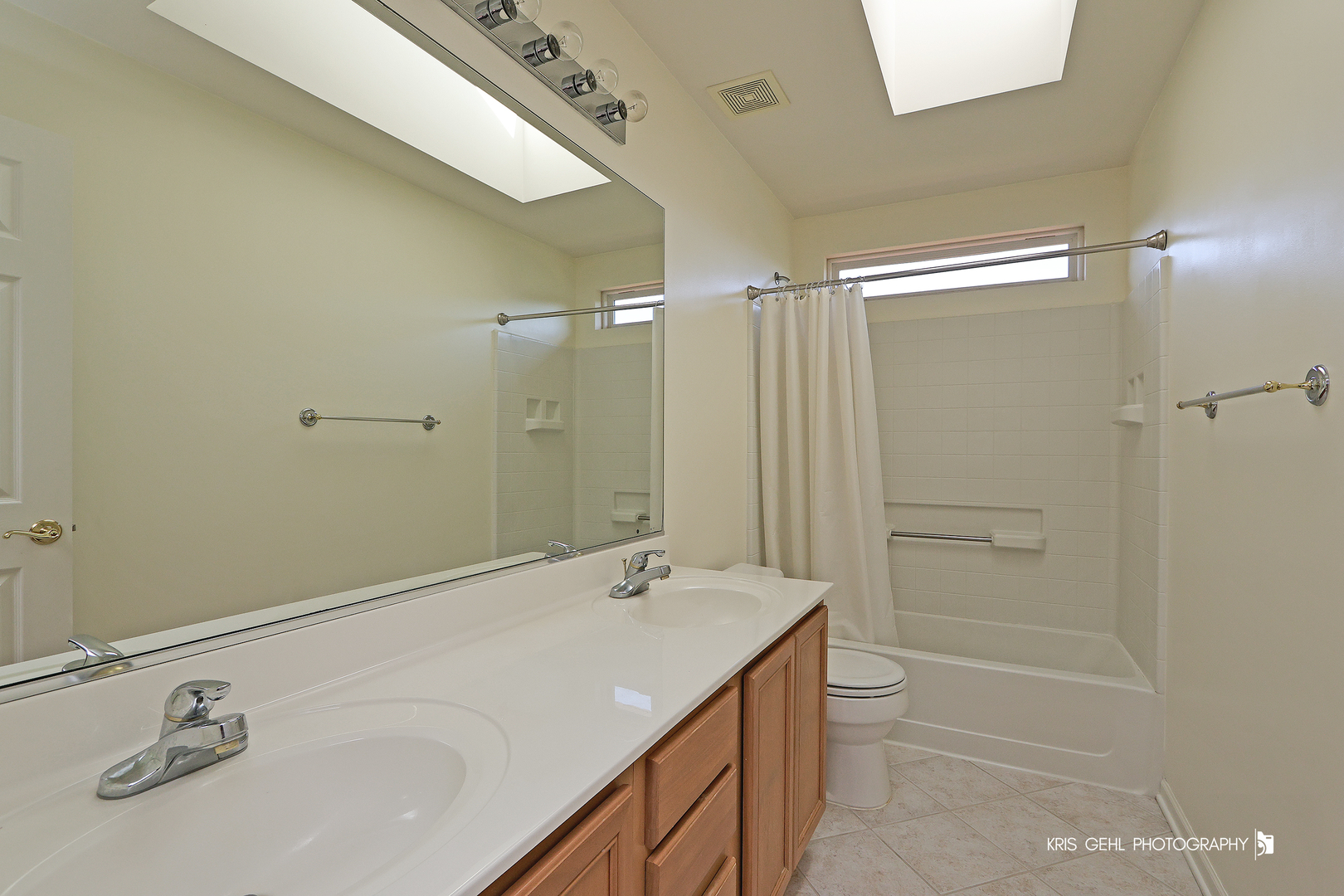 25619 West Bluestem Road Round Lake, IL 60073 - Photo 22 of 33 a bathroom with a granite countertop sink a toilet and shower
