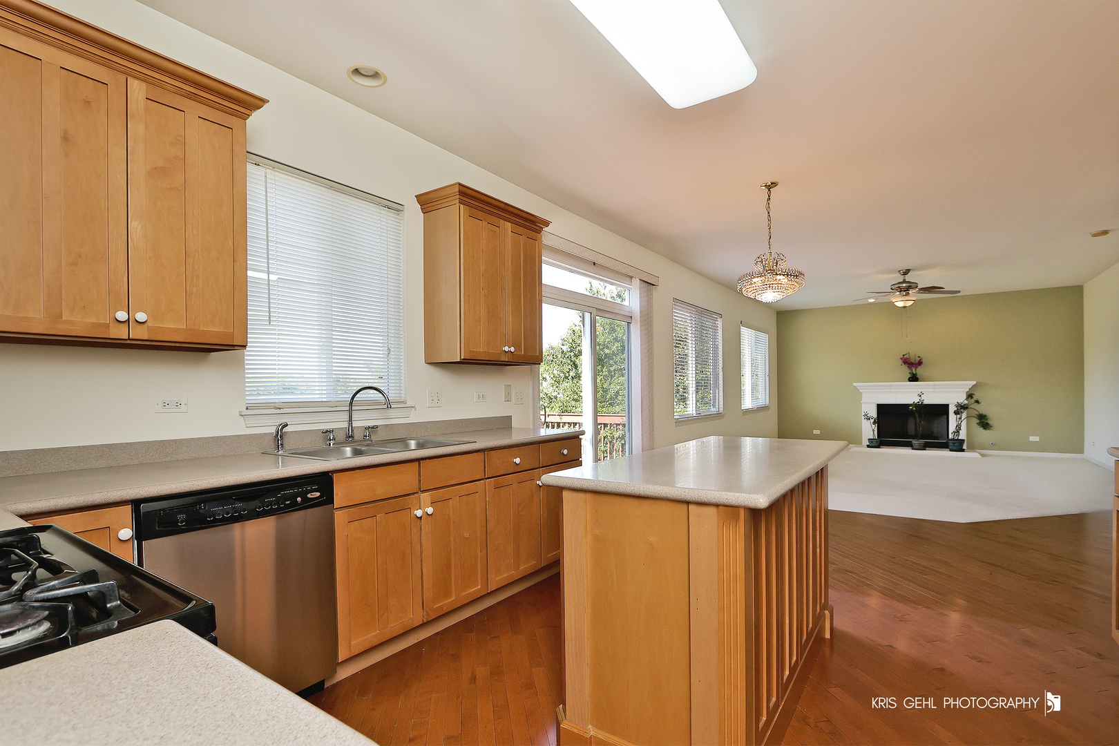 25619 West Bluestem Road Round Lake, IL 60073 - Photo 6 of 33 a kitchen with stainless steel appliances granite countertop a sink a stove and a refrigerator