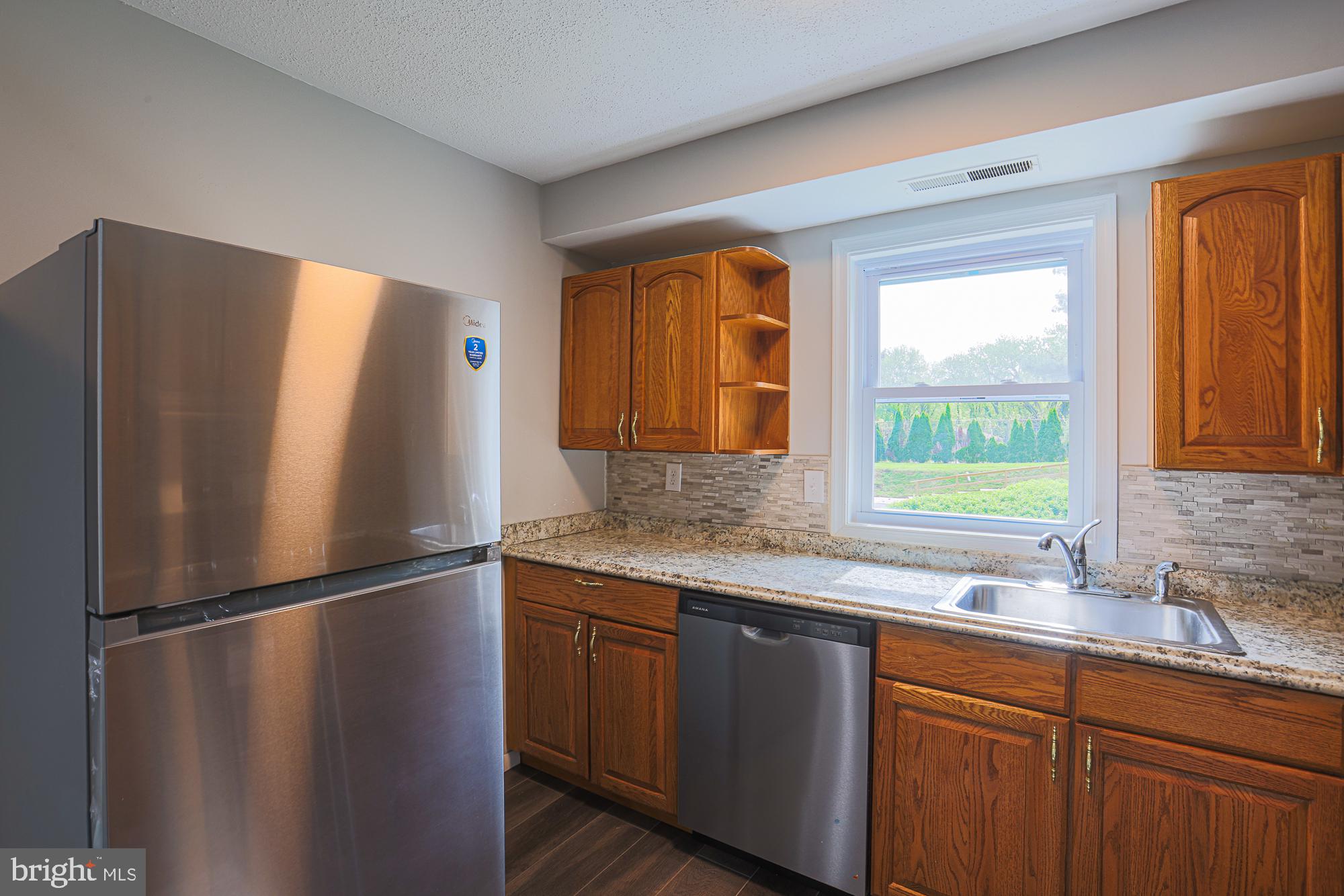 11908 Tarragon Road, Unit G Reisterstown, MD 21136 - Photo 13 of 22 Bright kitchen with modern finishes.