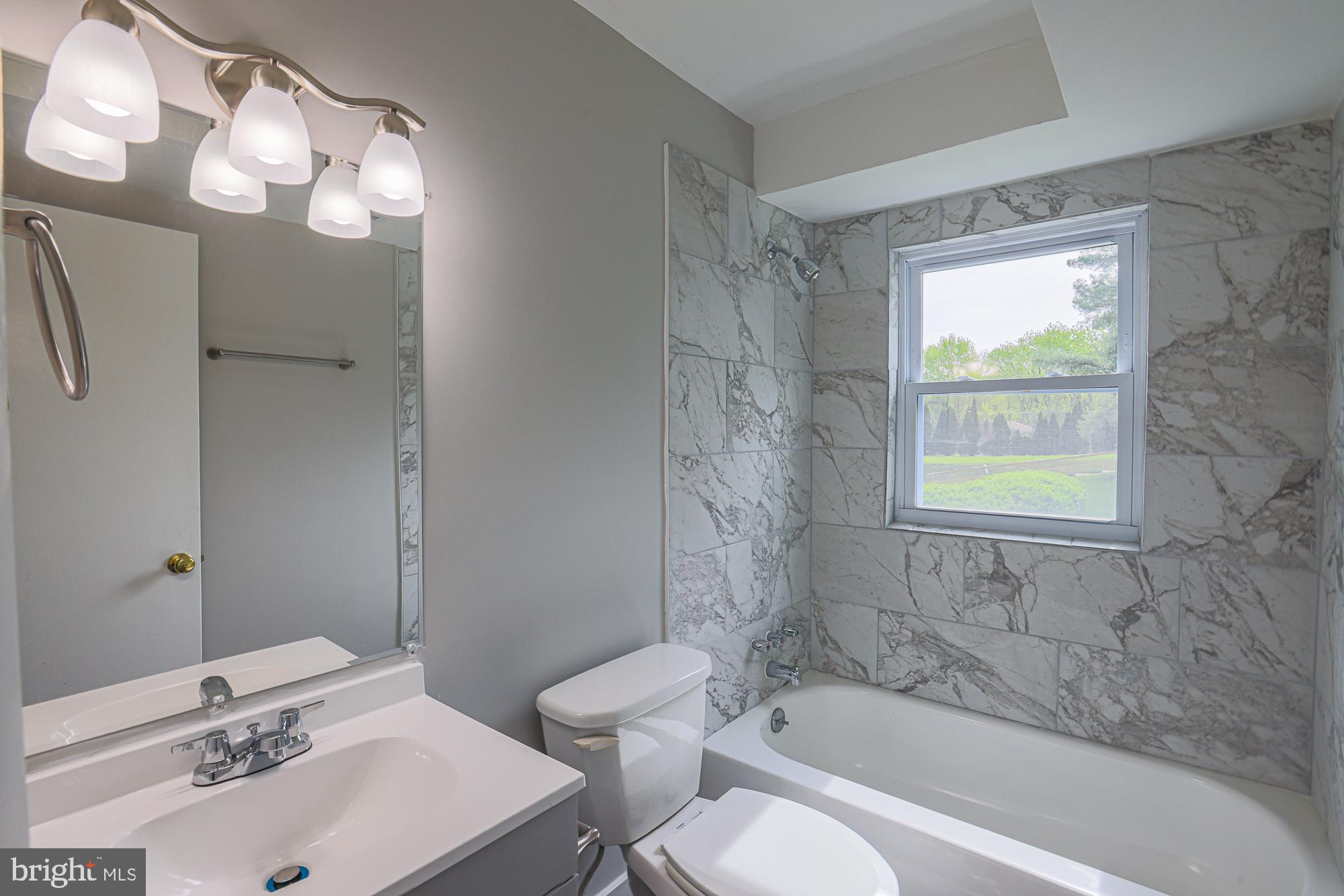 11908 Tarragon Road, Unit G Reisterstown, MD 21136 - Photo 15 of 22 Elegant bathroom with natural light.