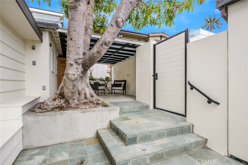 32015 Point Place Laguna Beach, CA 92651 - Photo 22 of 48 Gated entrance under Majestic Rubber Tree