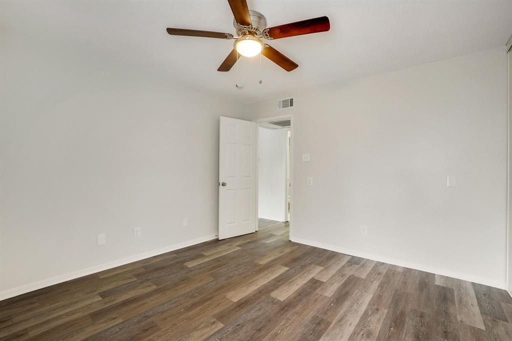 1105 UTA Boulevard, Unit 102 Arlington, TX 76013 - Photo 6 of 10 wooden floor in an empty room
