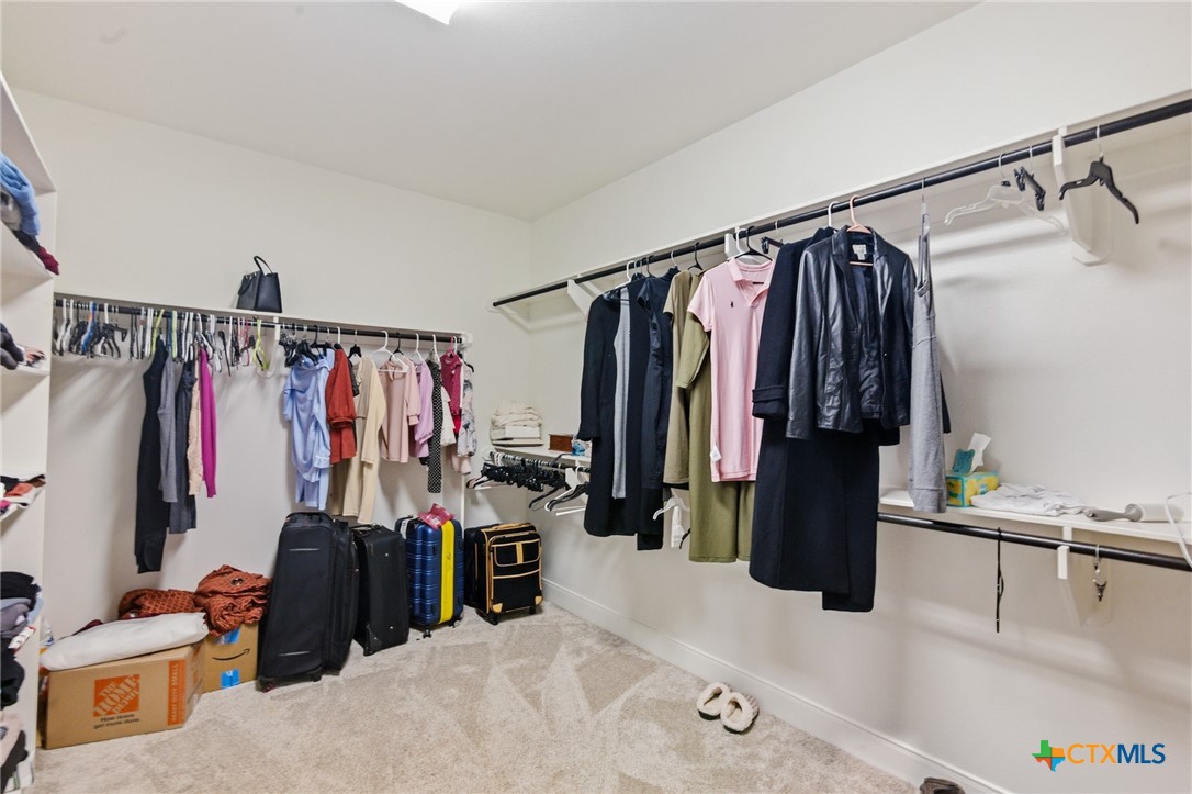 113 Terra Vista Ranch Road Victoria, TX 77904 - Photo 28 of 47 a view of walk in closet with clothes and shoes
